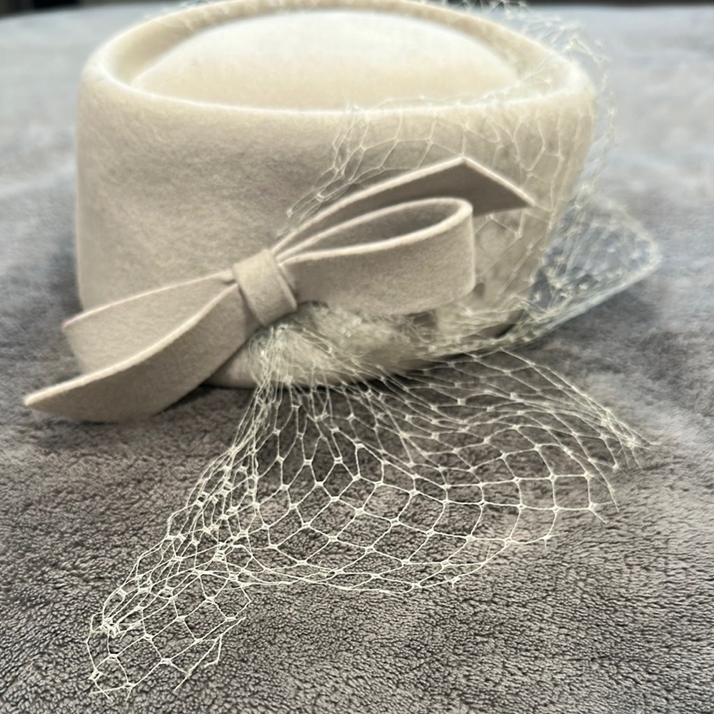 Elegant Cream Hat with Bow and Netting